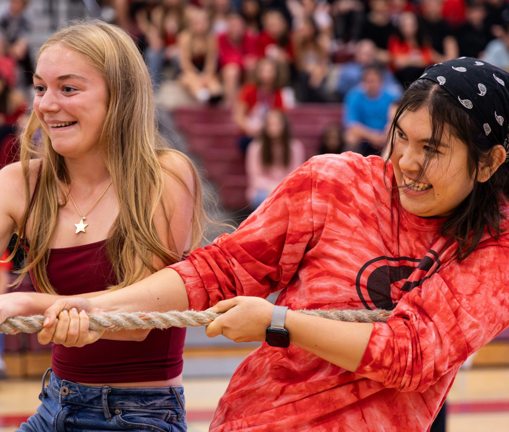 GHS students pulling rope in tug of war at spirit rally.