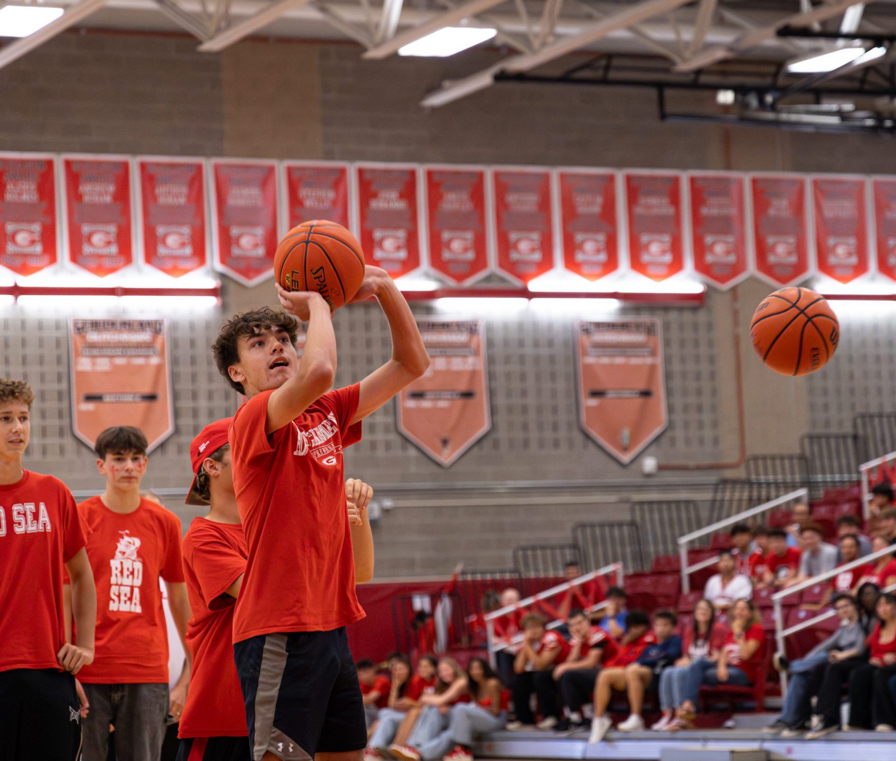 GHS student preparing to make a shot in basketball.