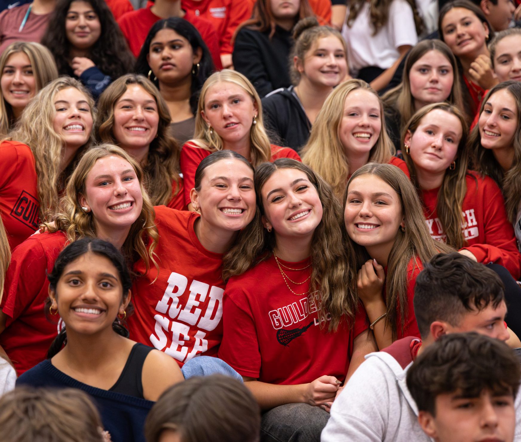 GHS students smiling in bleachers.