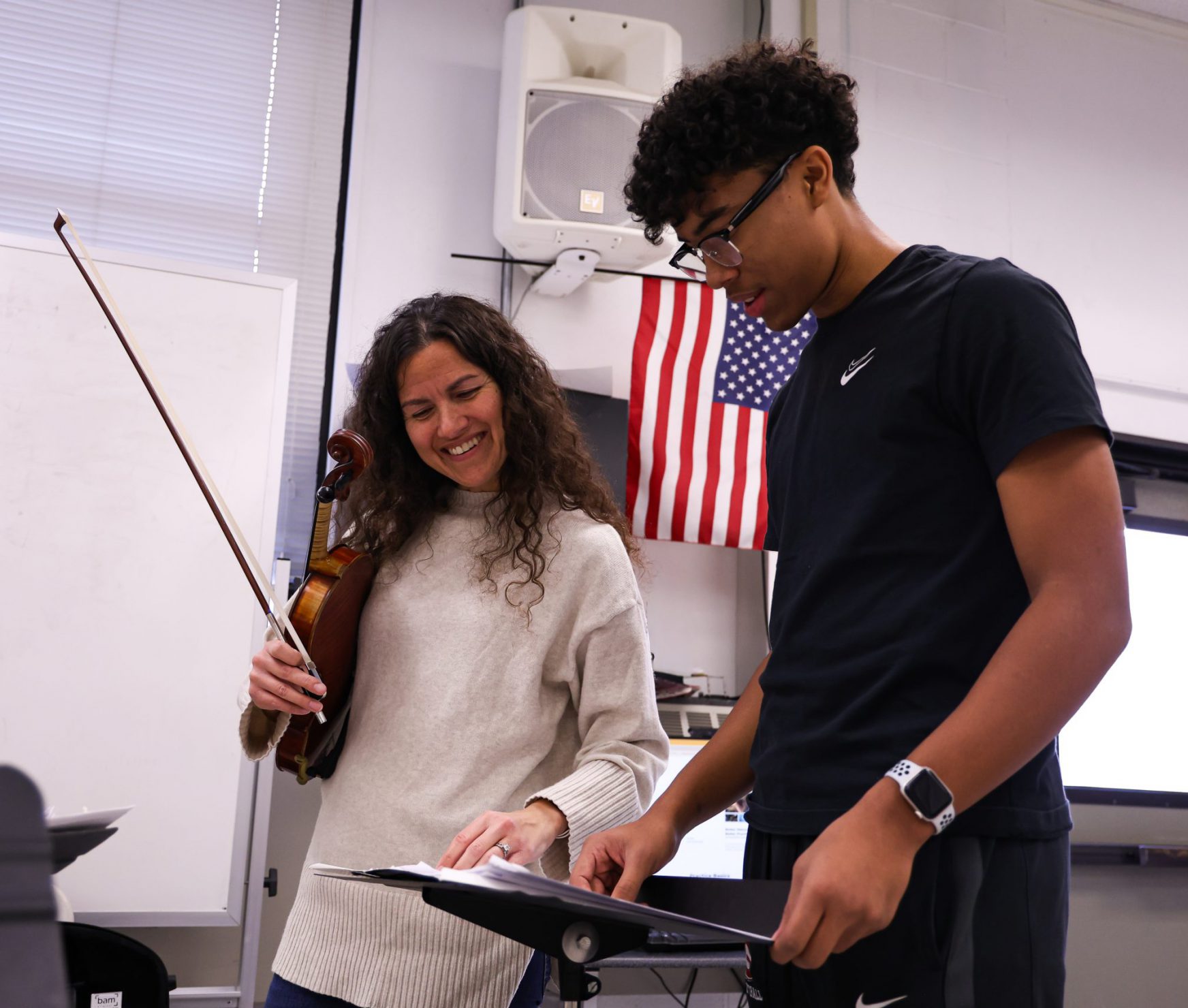 Student and music teacher practicing.