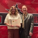Photo of Retiree Terri Cronin and Principal Mike Piscitelli